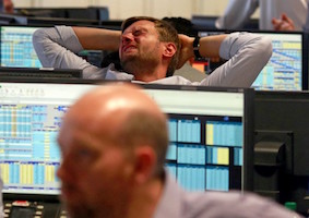 A trader from BGC in London's Canary Wharf reacts after Britain voted to leave the EU. REUTERS/Russell Boyce