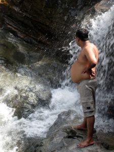 “Obese Man At Waterfall” by Indi Samarajiva is licensed under CC BY 2.0